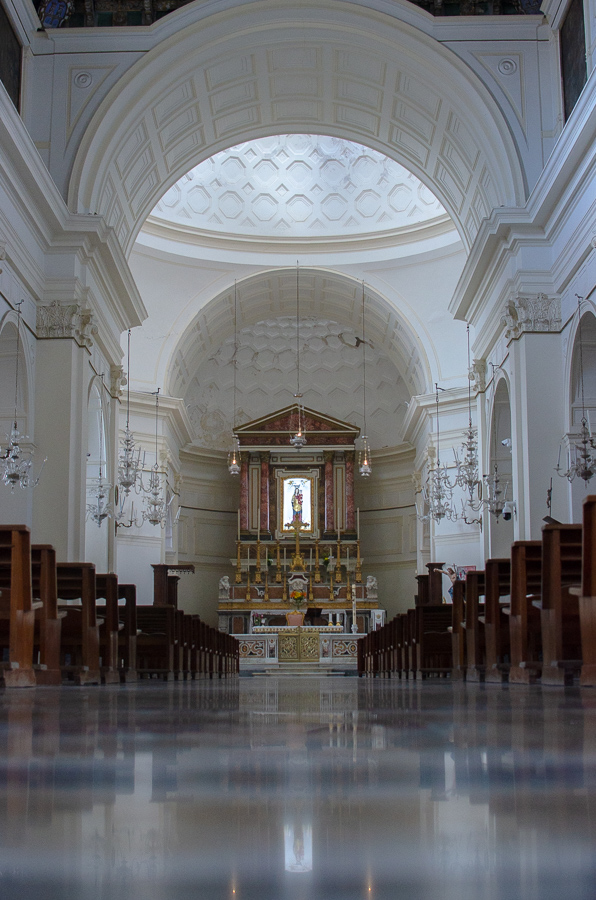 The interior of the Santa Maria al Mare church showcases the grandeur of the main nave with the beautifully adorned altar at the front.