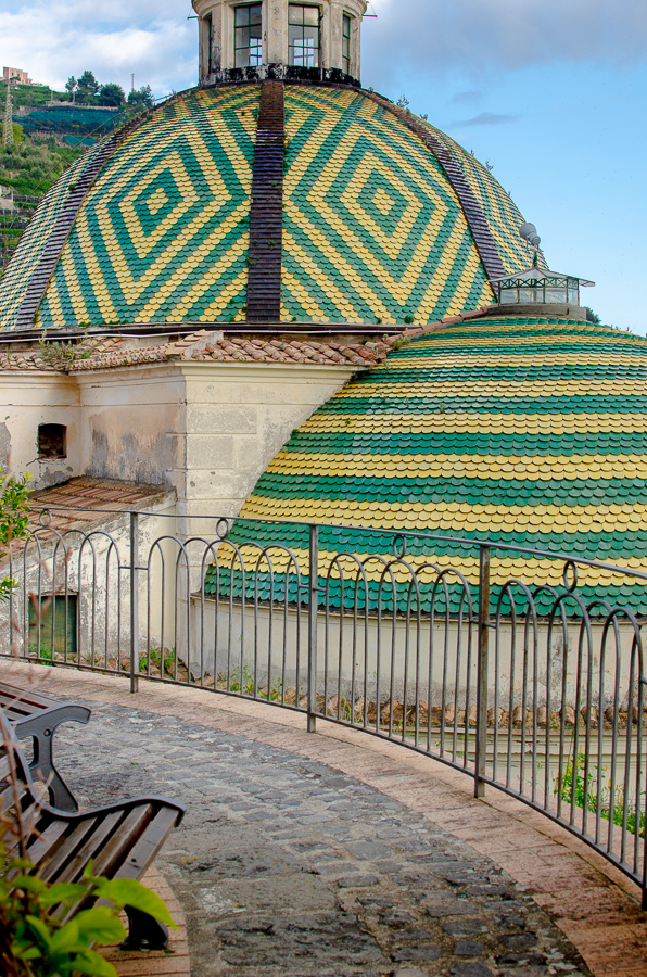 Picturesque terrace at the beginning of the Lemon Trail in Maiori, and featuring the beautiful cupola of a nearby church adorned with ceramic tiles.