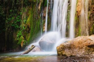 Image of a Waterfall in the Valle delle Ferriere, Amalfi Coast, Italy. Abundance of water flow, in a lush green environment.