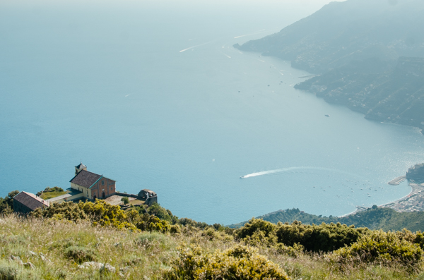 The Sanctuary Madonna dell'Avvocata above Minori.
Image taken from the mountain peak above the church. Little church in high elevation. The sea behind, the view of the coastline far away, and the town of Maiori partially visible far down.