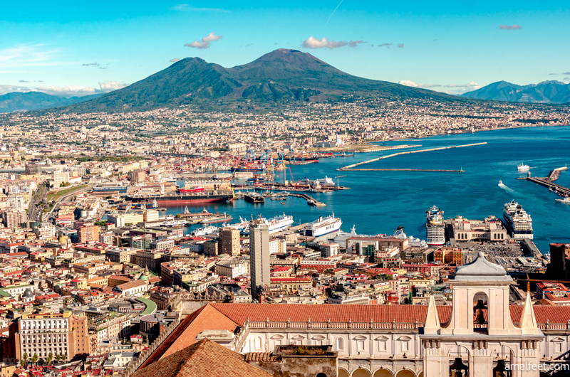 The view of Naples from the Castel Sant'Elmo. This is a great place to visit during a day trip to Naples, to see the bay of Naples, and the city from above. Also you can see the Vesuvius in the background very well from this panoramic point.